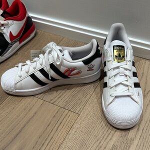 Adidas SuperStar J White Sneakers with Black Stripes and Gold Logo